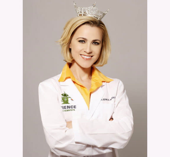 Erika Ebbel Angle wears both a pageant tiara and lab coat in her Dr. Erika TV show..