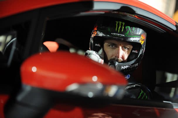 PHOTO: (FILES) In this file photo taken on March 24, 2013, US driver Ken Block of Hoonigan Racing Division Team, formerly known as the Monster World Rally Team, poses for a photo in a Ford Fiesta ST type car on ice of Budapest City Park Ice Rink. (Gergely Besenyei/AFP via Getty Images)