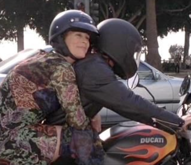 a couple of people on a motorcycle