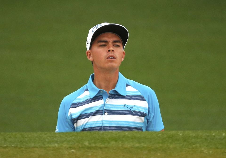 Rickie Fowler of the U.S. looks out from a sand trap on the second green during his practice round ahead of the 2015 Masters at the Augusta National Golf Course in Augusta, Georgia April 7, 2015. REUTERS/Phil Noble