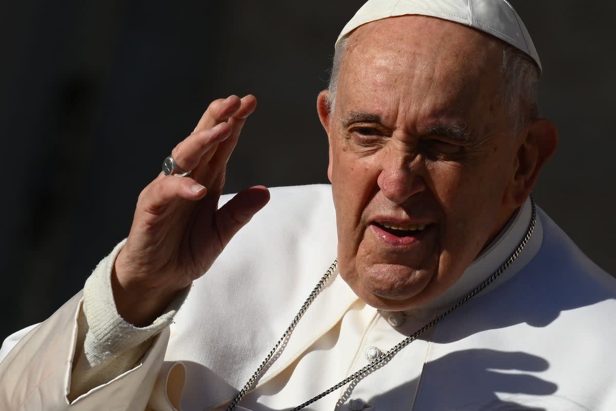 Pope Francis waves as he arrives for his weekly general audience (AFP via Getty Images)