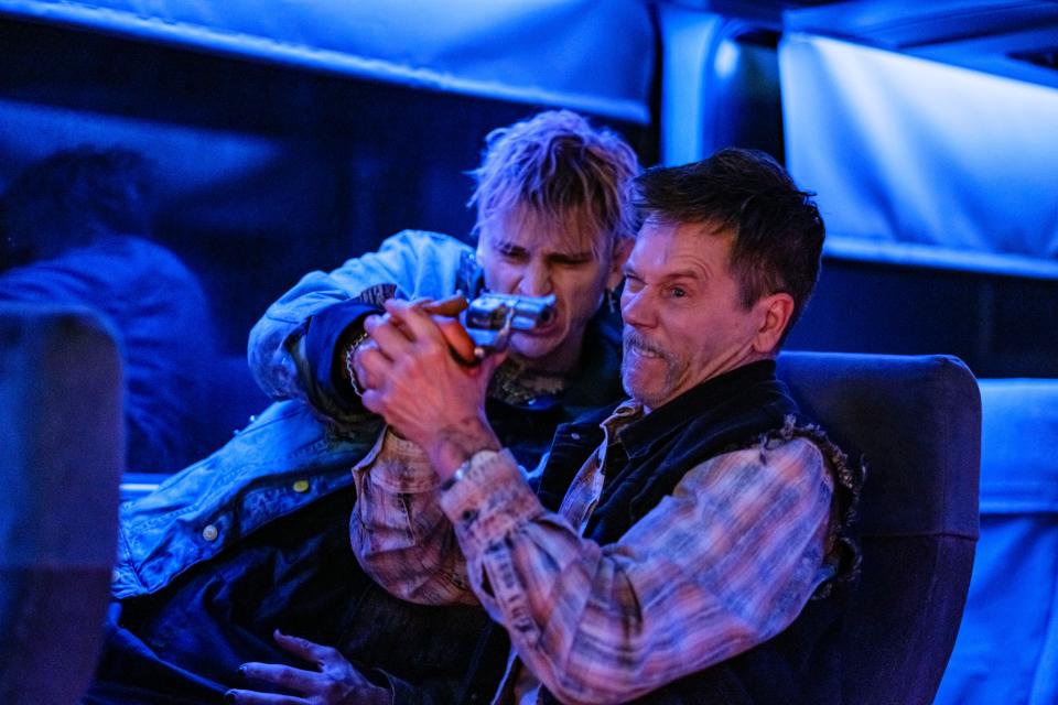 Colson Baker (left) and Kevin Bacon tussle on a bus in the action thriller "One Way."