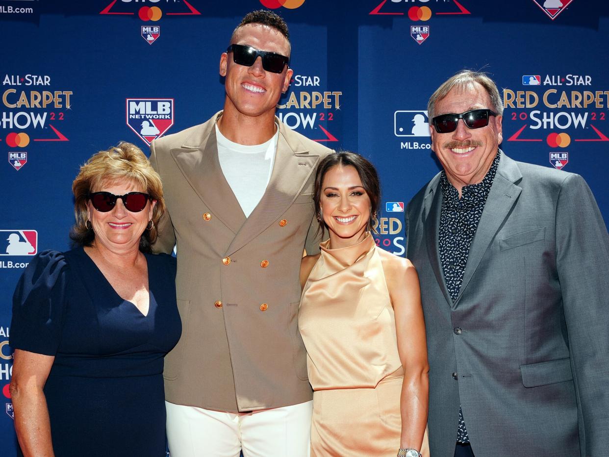 Aaron Judge of the New York Yankees poses for a photo with family during the All-Star Red Carpet Show at L.A. Live on Tuesday, July 19, 2022 in Los Angeles, California