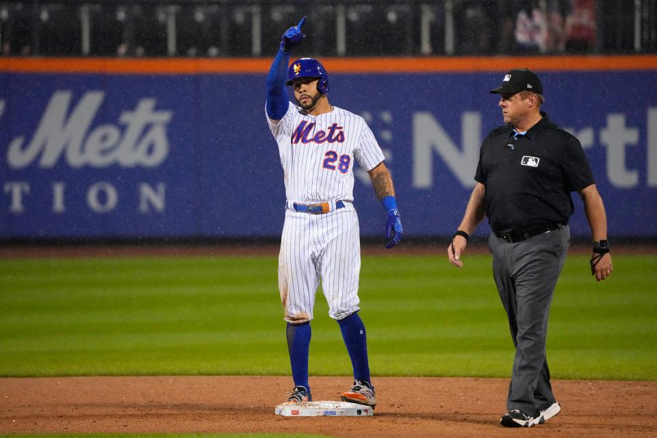 New York Mets left fielder Tommy Pham (28) reacts to hitting a double against the San Francisco Giants during the eighth inning on July 2, 2023, at Citi Field.