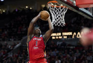 New Orleans Pelicans forward Zion Williamson dunks against the Portland Trail Blazers during the second half of an NBA basketball game in Portland, Ore., Tuesday, April 9, 2024. (AP Photo/Craig Mitchelldyer)