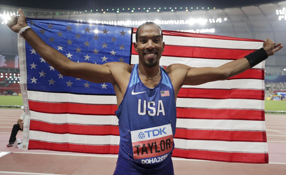 Christian Taylor, of the United States, celebrates after winning the gold medal in the men's triple jump final at the World Athletics Championships in Doha, Qatar, Sunday, Sept. 29, 2019. (AP Photo/Hassan Ammar)