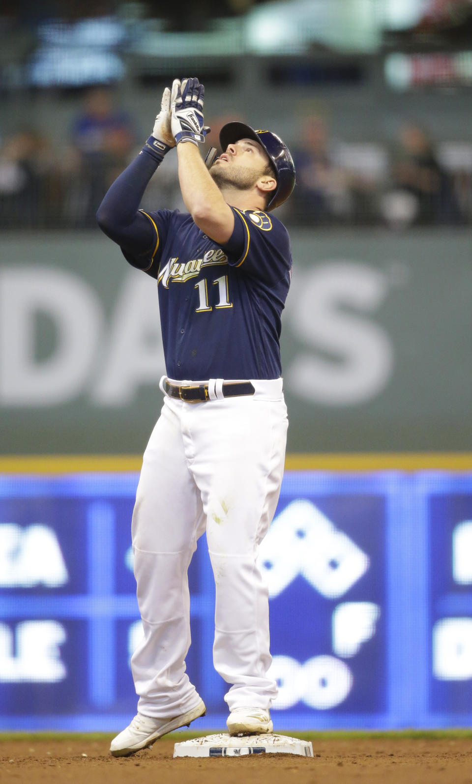 Milwaukee Brewers' Mike Moustakas reacts after his run-scoring double during the third inning of a baseball game Saturday, May 4, 2019, in Milwaukee. (AP Photo/Jeffrey Phelps)