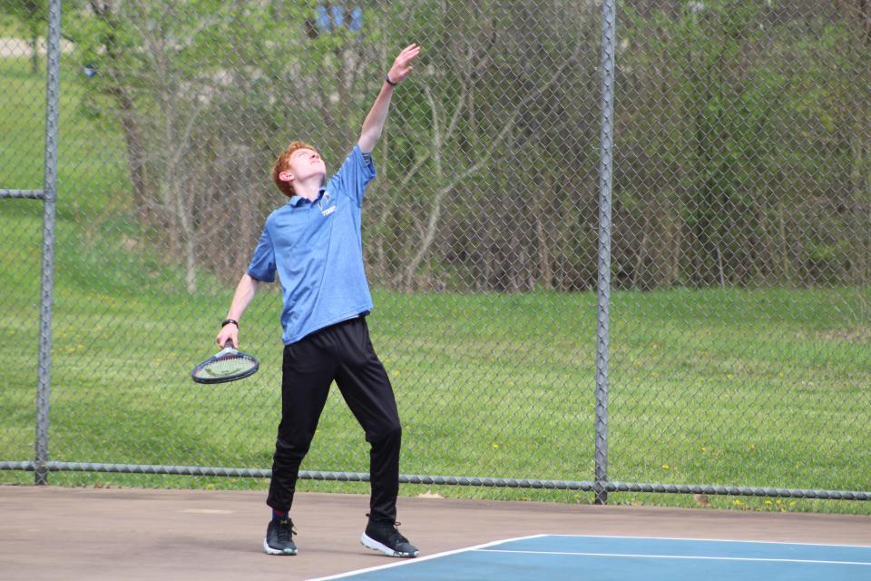 Ravenna's Parker Addison prepares a serve at the Metro Athletic Conference Tournament on Wednesday, May 4, 2022.