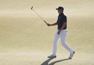 Jun 21, 2015; University Place, WA, USA; Jordan Spieth waves to the crowd on the 18th green in the final round of the 2015 U.S. Open golf tournament at Chambers Bay. Mandatory Credit: Kyle Terada-USA TODAY Sports