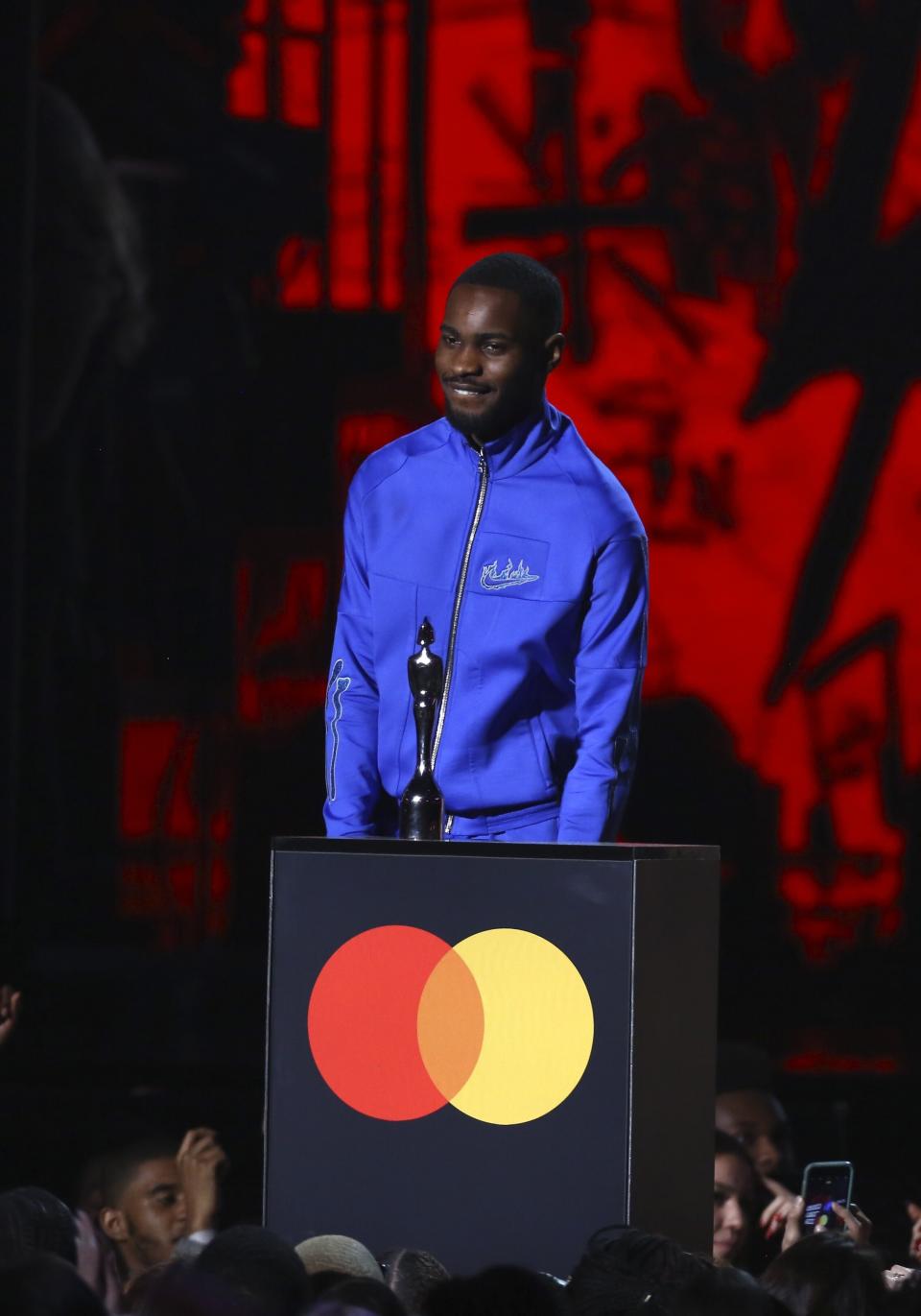 Dave accepts the award for Album of the Year on stage at the Brit Awards 2020 in London, Tuesday, Feb. 18, 2020. (Photo by Joel C Ryan/Invision/AP)