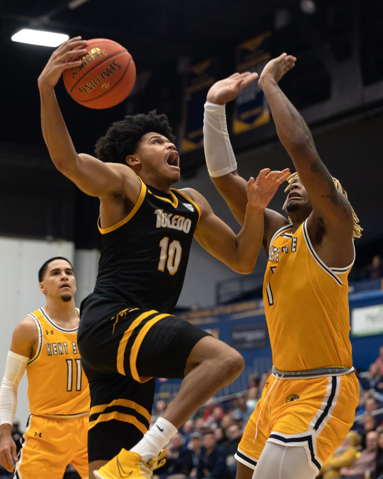 Toledo guard RayJ Dennis goes up for a shot against Kent State forward VonCameron Davis during an NCAA basketball game, Tuesday, Jan. 10, 2023 at the Kent State M.A.C. Center.