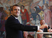 <p>French independent centrist presidential candidate Emmanuel Macron casts his ballot in the presidential runoff election in Le Touquet, France, Sunday, May 7, 2017. (Christophe Ena, Pool via AP) </p>