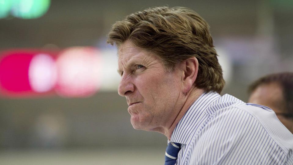 Detroit Red Wings head coach Mike Babcock watches his team warm up prior to the game between the Dallas Stars and the Red Wings in Dallas, Texas, in this file photo taken February 21, 2015. The Toronto Maple Leafs won the Mike Babcock sweepstakes on Wednesday by beating out a handful of teams that tried to land the highly-coveted head coach who spent the last 10 NHL seasons with the Detroit Red Wings.   Mandatory Credit: Jerome Miron-USA TODAY Sports/Files