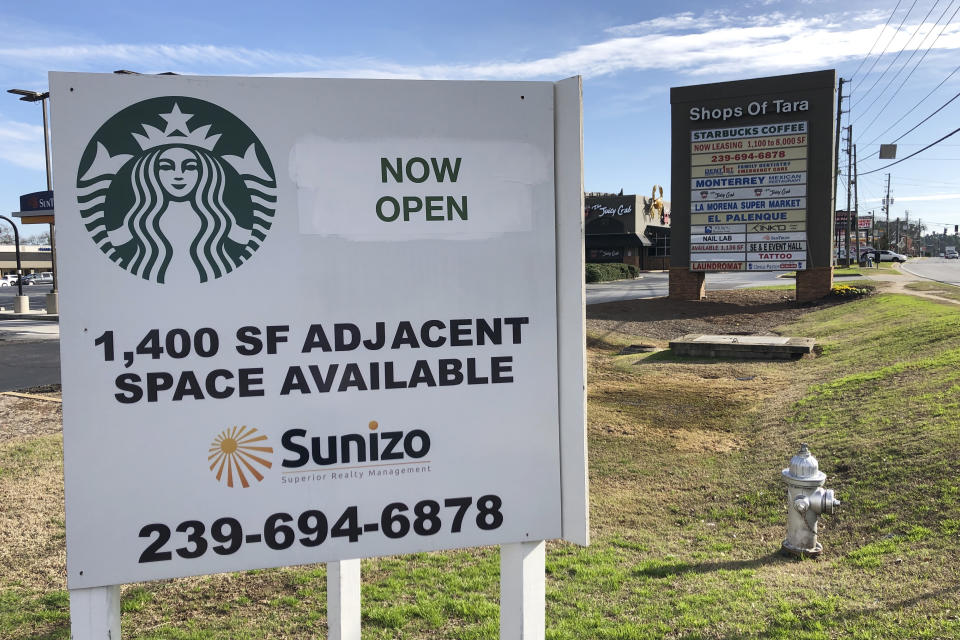 Signage is seen on Thurso ay, Jan. 16, 2019, in Jonesboro, Ga., for a Starbucks that has opened. Starbucks has a point to prove: There's more to the company than selling $4 lattes to rich people. Starbucks plans to open or remodel 85 stores by 2025 in rural and urban communities across the U.S. (AP Photo/Sudhin Thanawala)