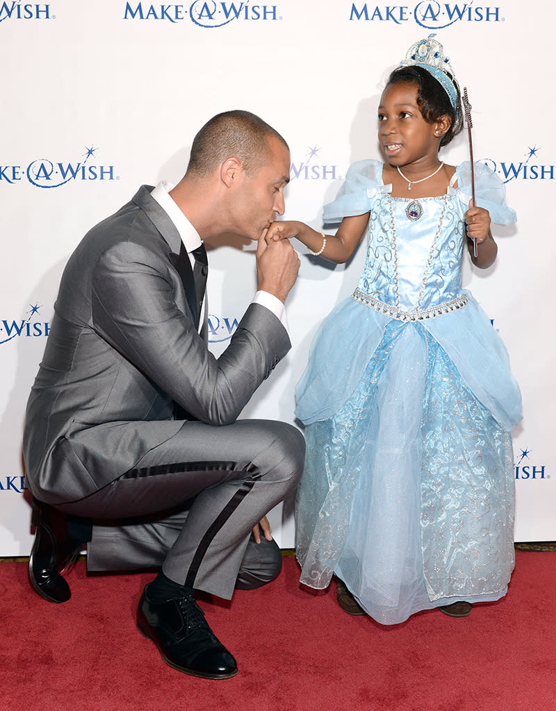 Get ready to meet your quota of cuteness for the week with this picture! Photographer and "America's Next Top Model" judge Nigel Barker was quite the gentleman when he introduced himself to a little princess on Thursday night at Make-A-Wish Metro New York's 30th Anniversary Gala, dubbed "An Evening of Wishes." <a href="http://wish.org/" rel="nofollow noopener" target="_blank" data-ylk="slk:The charity;elm:context_link;itc:0;sec:content-canvas" class="link ">The charity</a> grants wishes of children with life-threatening diseases. (6/13/2013)