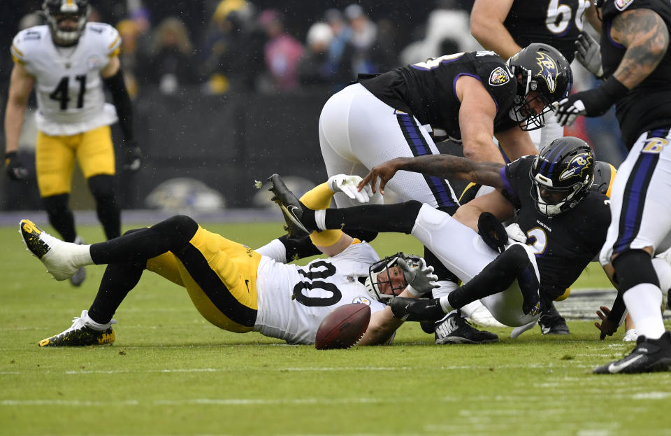 T.J. Watt (90) forces a fumble by Ravens quarterback Tyler Huntley (2) during the first quarter Pittsburgh Steelers versus Baltimore Ravens National Football League game at M&T Bank Stadium on January 9, 2022 in Baltimore, MD. (Photo by Randy Litzinger/Icon Sportswire via Getty Images)