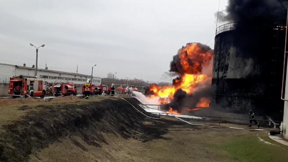 A video screengrab shows firefighters responding to a fire that broke out at a fuel depot in Belgorod, Russia, which the regional governor blamed on an attack by Ukrainian military helicopters on April 1, 2022. / Credit: Russian Ministry of Emergency Situations/Handout/Anadolu/Getty