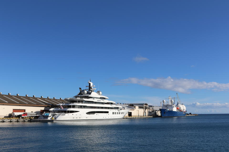 The superyacht Amadea is moored in Honolulu on Thursday, June 16, 2022. The Russian-owned superyacht seized by the United States arrived in Honolulu Harbor flying a U.S. flag after the U.S. last week won a legal battle in Fiji to take the $325 million vessel. (AP Photo/Audrey McAvoy)