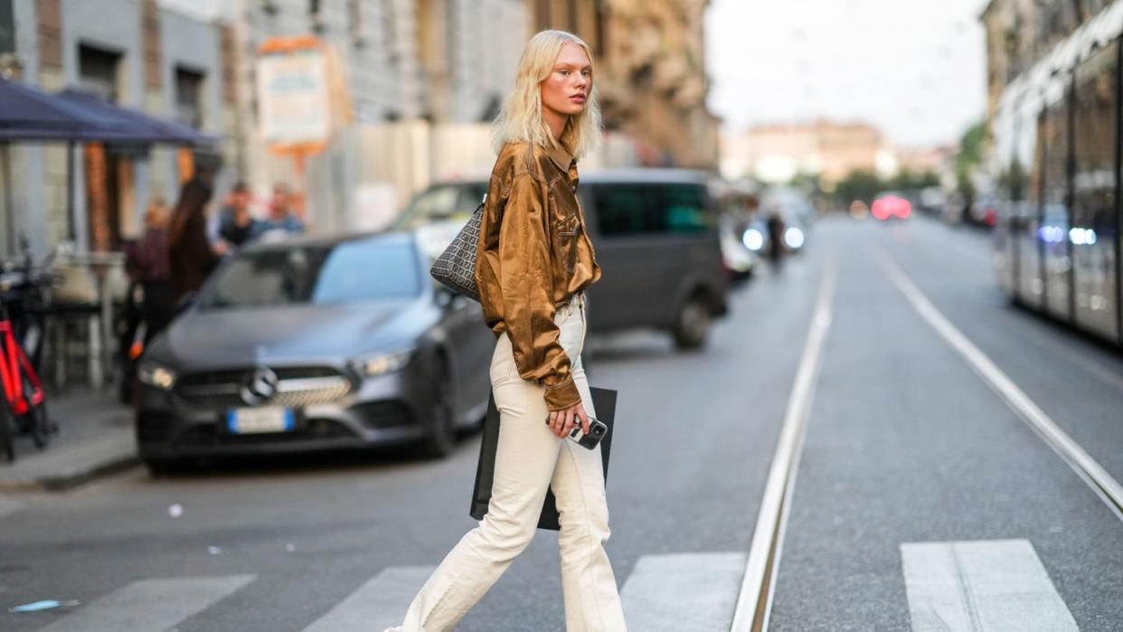 a person walking across a crosswalk