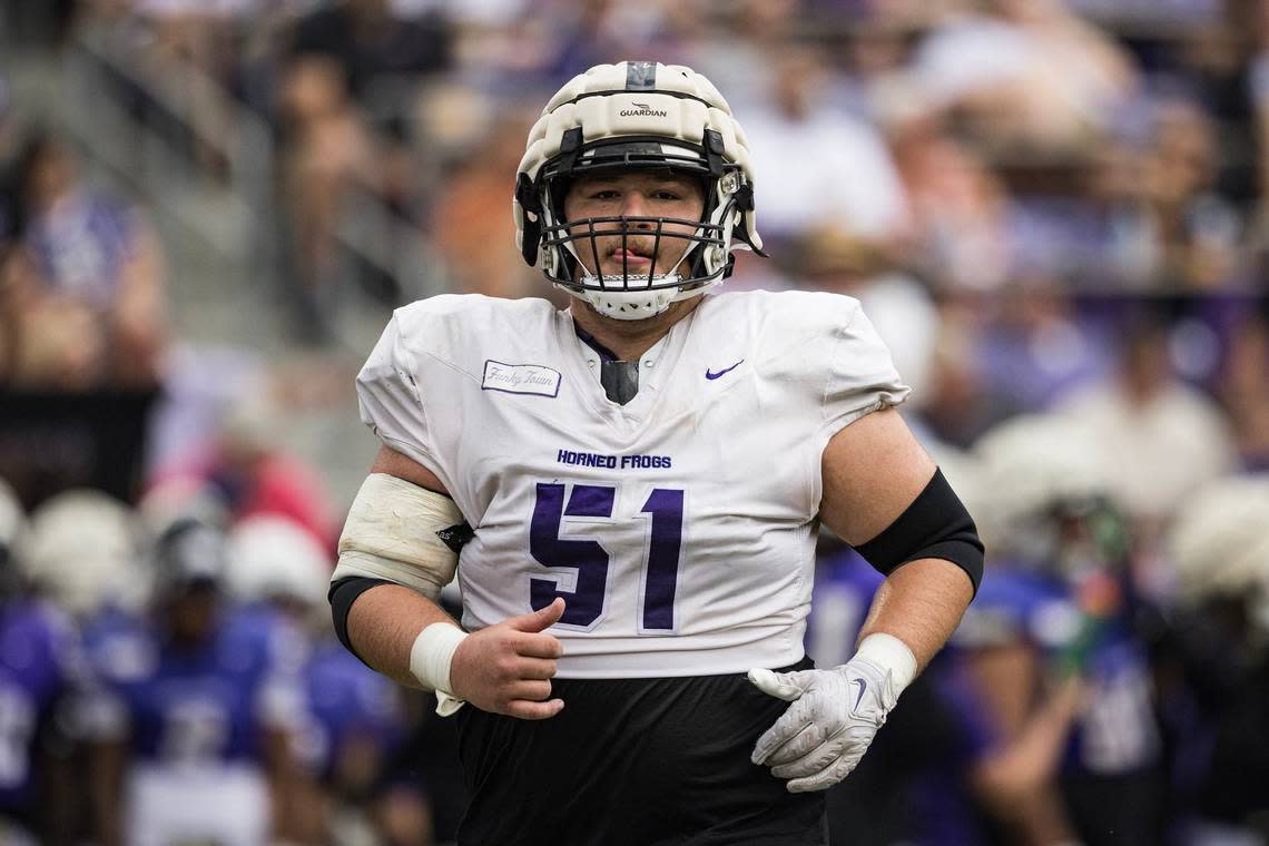 TCU offensive lineman Coltin Deery (51) runs back to get set up on the line in a TCU football Spring Scrimmage at Amon G. Carter Stadium in Fort Worth on Saturday..