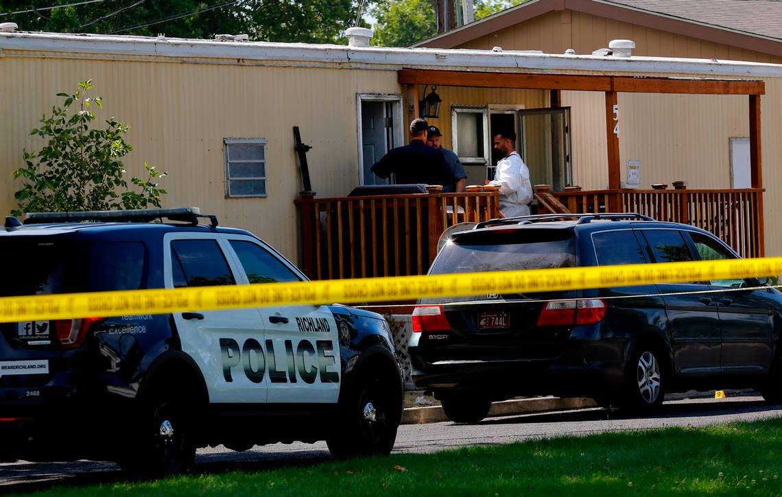 Richland police detectives investigate the deadly double stabbing crime scene Wednesday morning at 54 Cosmic Lane in north Richland. The victims, a man and Bethany Lowe, were taken to Kadlec Regional Medical Center in Richland. She died there and the man was in serious condition with multiple stab wounds, according to police officials.