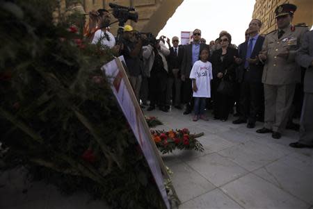 The widow and son of late President Anwar Sadat pay their respects at his tomb in Cairo