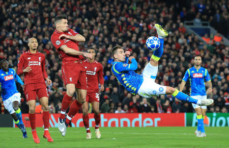 Soccer Football - Champions League - Group Stage - Group C - Liverpool v Napoli - Anfield, Liverpool, Britain - December 11, 2018 Napoli's Arkadiusz Milik in action with Liverpool's Dejan Lovren REUTERS/Jon Super