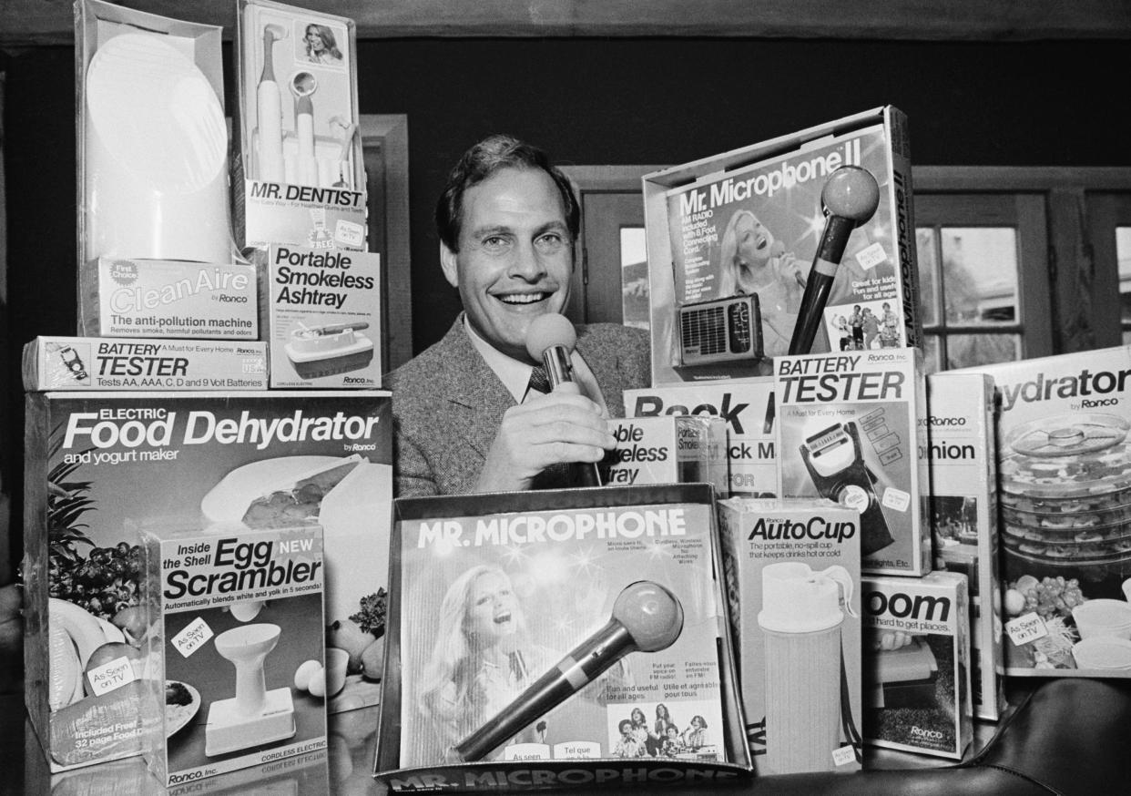 Ron Popeil, the man behind those late-night, rapid-fire television commercials that sell everything from the Mr. Microphone to the Pocket Fisherman to the classic Veg-a-Matic, sits surrounded by his wares in his Beverly Hills office on Dec. 8, 1982. His Ronco Company accounts for $35 million in annual retail sales with its current line of 17 products.