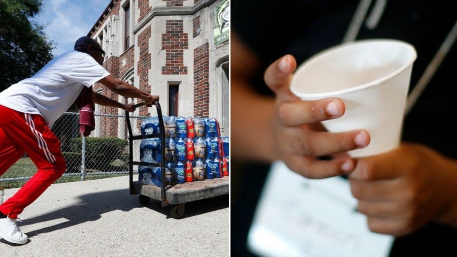 Teacher Cedric Cook pushes cases of water into Noble School in Detroit, Tuesday, Sept. 4, 2018. Some 50,000 Detroit public school students will start the school year Tuesday by drinking water from coolers, not fountains, after the discovery of elevated levels of lead or copper — the latest setback in a state already dealing with the consequences of contaminated tap water in Flint and other communities. (AP Photo/Paul Sancya)