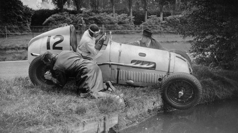 Racer G E Abecassis narrowly missed a lake when his car skidded off the track during preparations for the Sydenham Trophy meeting in 1938.