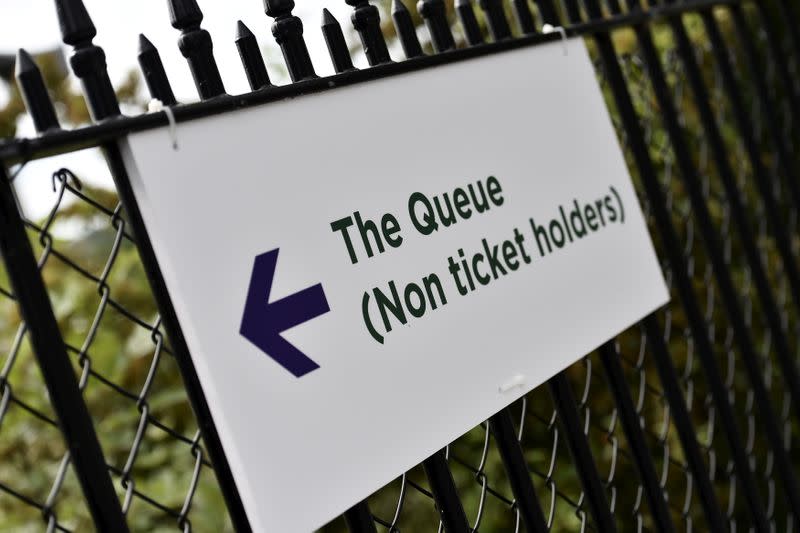 FILE PHOTO: A sign is seen for the ticket queue at Wimbledon in London