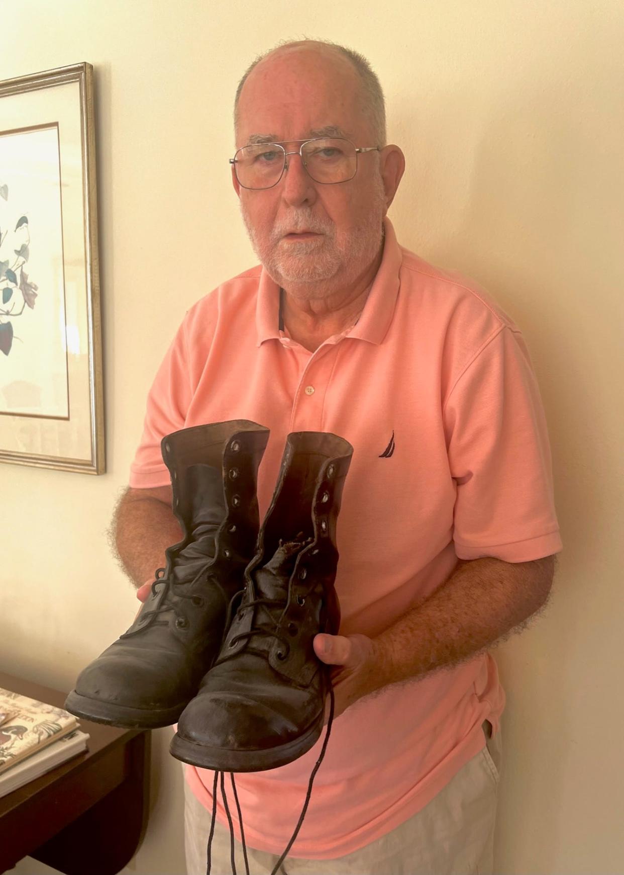 Max Hauth, 77, in Lakeland with his combat boots from Vietnam.