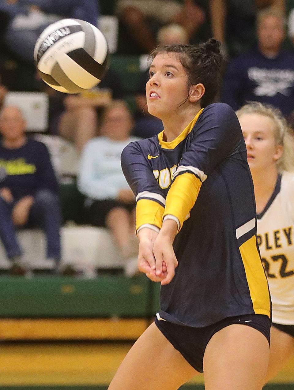 Copley's Katey Firestine returns a serve against Highland on Sept. 20, 2022, in Hinckley.