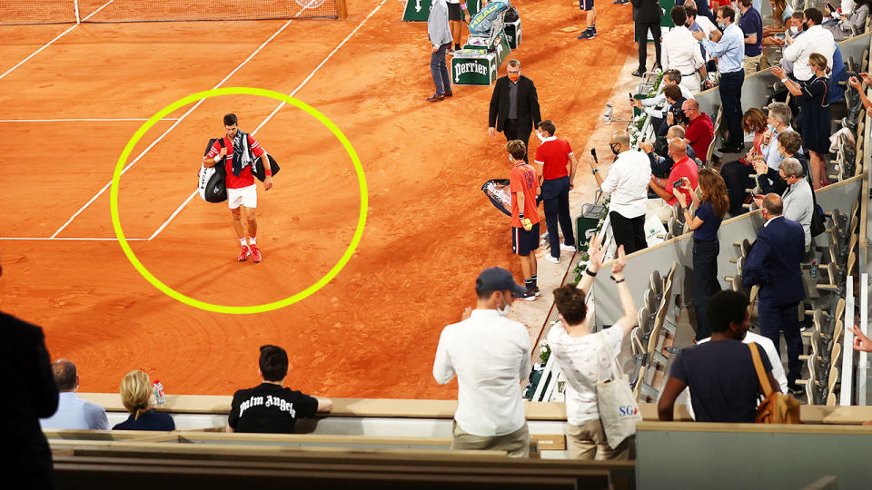 Novak Djokovic, pictured here walking off the court after play was suspended during his quarter-final clash with Matteo Berrettini.