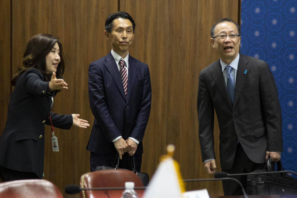 South Korea's Seo Min-jeong, left, director-general of the Asian and Pacific Affairs Bureau, greets Japan's Funakoshi Takehiro Funakoshi, right, director-general of Foreign Ministry's Asian and Oceanian Affairs Bureau and Japan's Atsushi Ando, deputy director-general of Defense Ministry's Defense Policy Bureau, prior to their meeting at the Foreign Ministry in Seoul Monday, April 17, 2023. (Jeon Heon-Kyun/Pool Photo via AP)