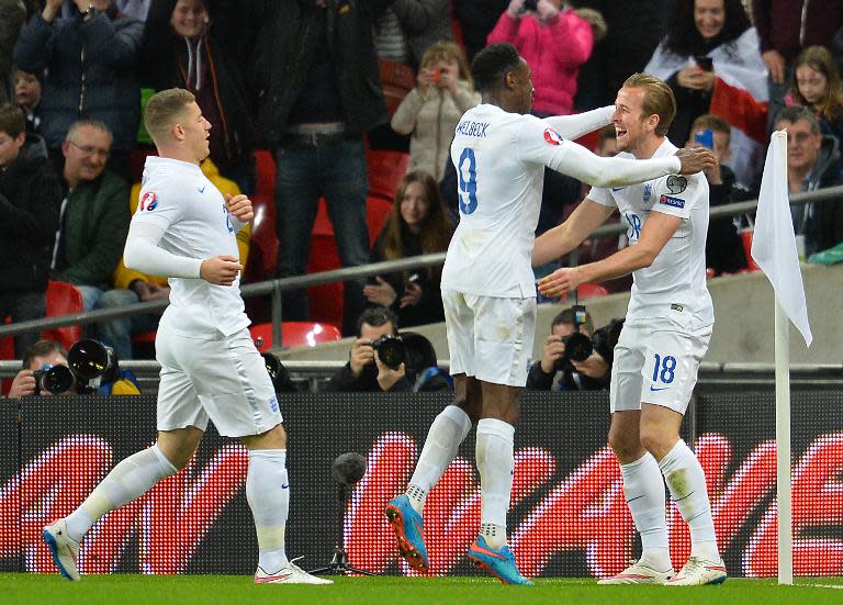 England's Harry Kane (R) celebrates after scoring during the Euro 2016 Group E qualifying match against Lithuania at Wembley Stadium on March 27, 2015