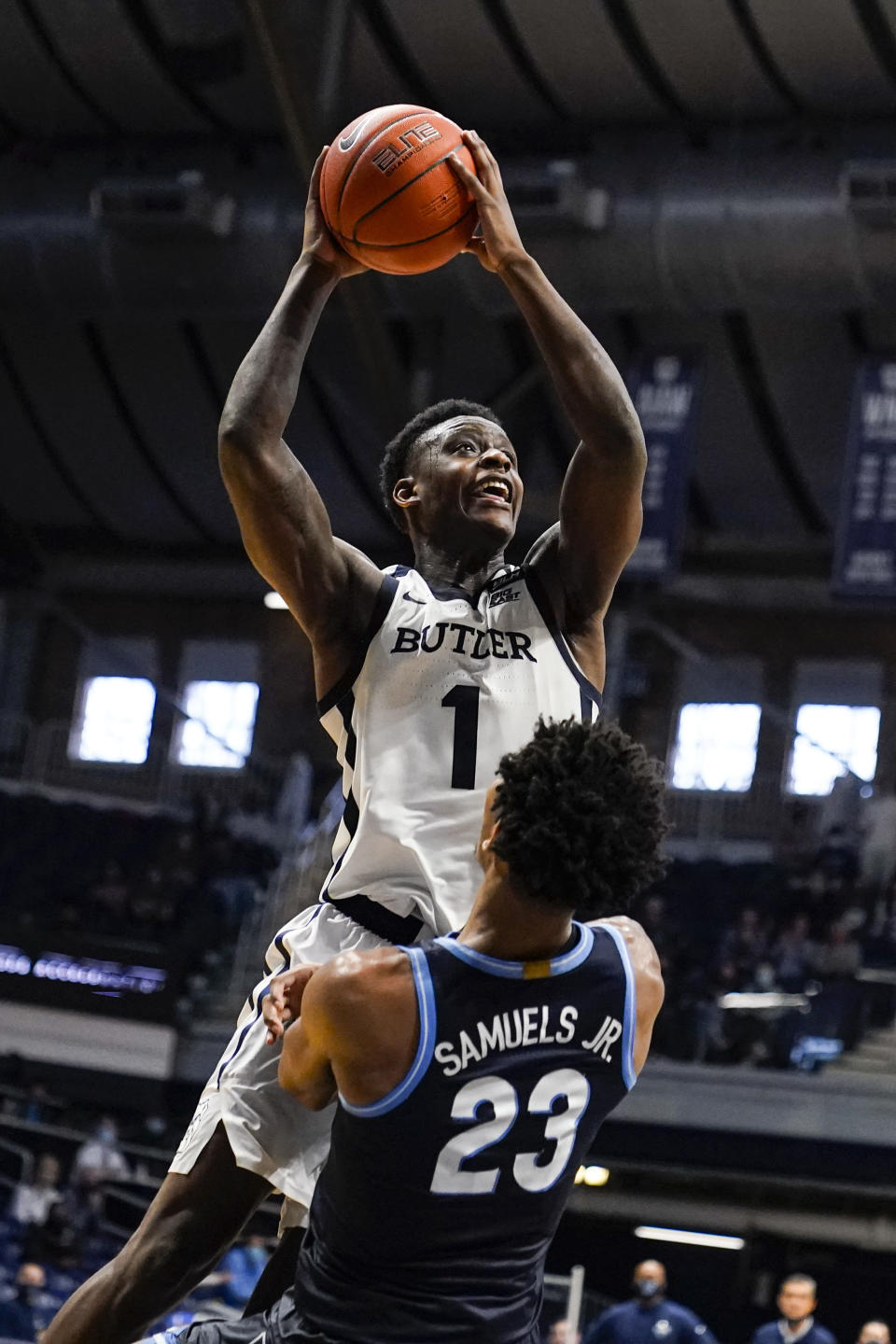 Butler guard Bo Hodges (1) is fouled as he shoots by Villanova forward Jermaine Samuels (23) in the second half of an NCAA college basketball game in Indianapolis, Sunday, Feb. 28, 2021. (AP Photo/Michael Conroy)