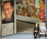 FILE - Nobel Commitee chairman Thorbjorn Jagland sits next to an empty chair with the Nobel Peace Prize medal and diploma during a ceremony honoring Nobel Peace Prize laureate Liu Xiaobo at city hall in Oslo, Norway, on Dec. 10, 2010. Liu was serving an 11-year sentence for inciting subversion by advocating sweeping political reforms and greater human rights in China. (AP Photo/John McConnico, File)