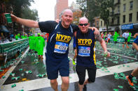 <p>Two members of the NYPD running club break for water and a photo during the 2017 New York City Marathon, Nov. 5, 2017. (Photo: Gordon Donovan/Yahoo News) </p>