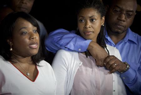 Valarie (L) and Amy Carey, sisters of Miriam Carey, the woman involved in the Capitol Hill shooting, attend a news conference outside their home in the Brooklyn borough of New York, October 4, 2013. REUTERS/Carlo Allegri