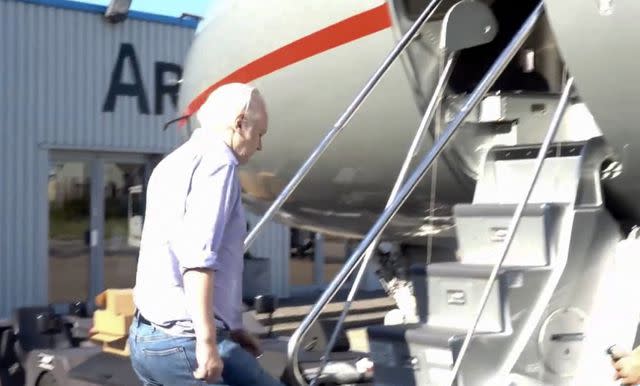 <p>WikiLeaks/AFP via Getty</p> Julian Assange boards a plane from London Stansted Airport on June 24, 2024.