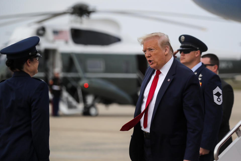 President Donald Trump speaks after exiting Air Force One as he returns from Allentown, Pa., to Andrews Air Force Base, Md., Thursday, May 14, 2020. (Carlos Barria/Pool via AP)