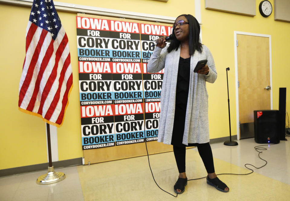 Former chairwoman of the Iowa Democratic Black Caucus Jamie Woods introduces Democratic presidential candidate Sen. Cory Booker to speak during the Iowa Democratic Party Black Caucus Reception, Tuesday, April 16, 2019, in Des Moines, Iowa. In Iowa _ that’s right _ black Democrats are more energized than they’ve been since Barack Obama’s 2008 presidential campaign and are poised to make a mark on the 2020 race. (AP Photo/Charlie Neibergall)