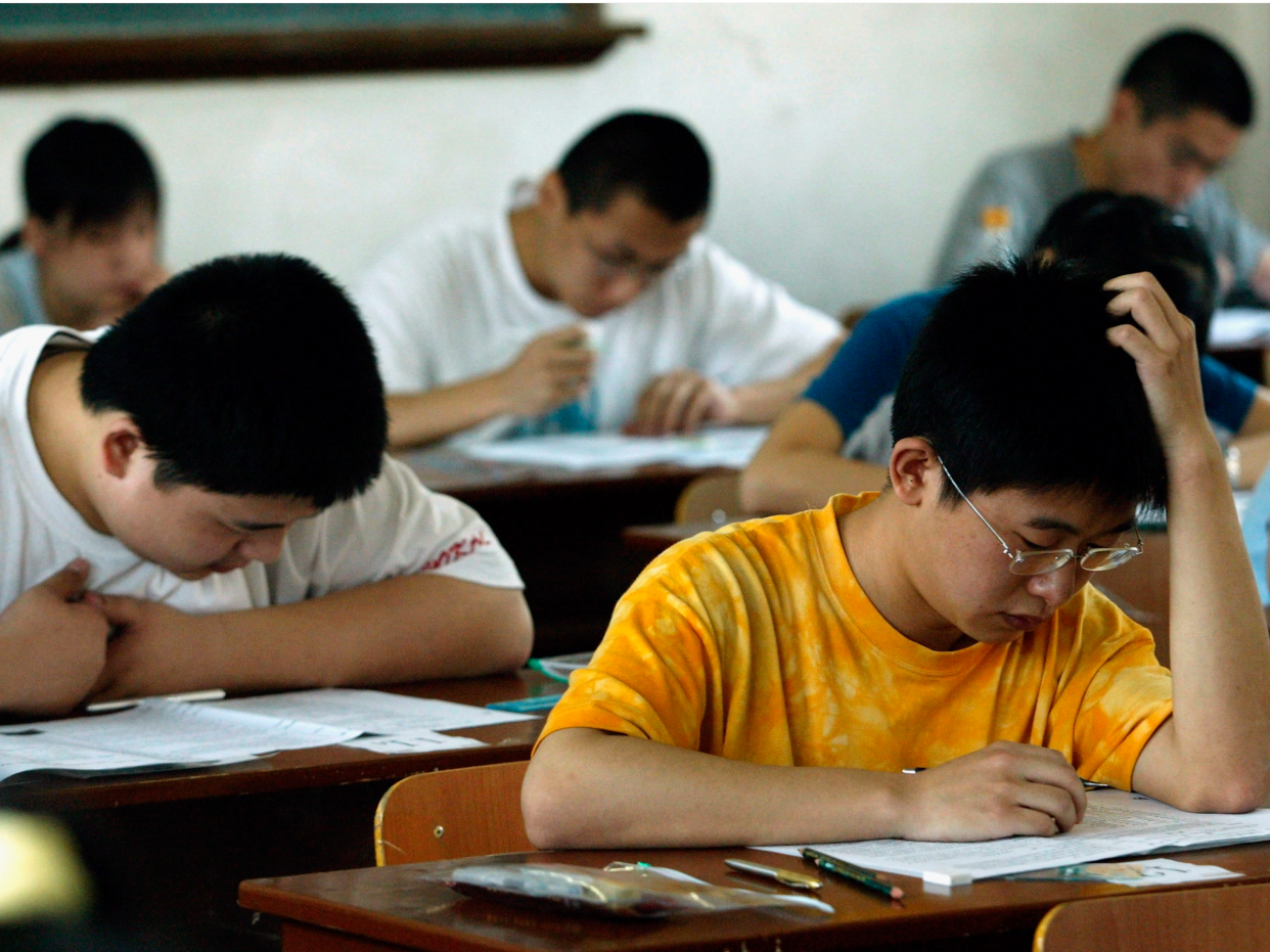 Students take part in the college entrance exam at an exam room in a middle school on June 7, 2005 in Xian of Shaanxi Province, China. About 8.67 million students will sit the national entrance examination for college this year. The target number of full time higher education enrolments for 2005 is 4.75 million, an 8 percent increase on 2004.