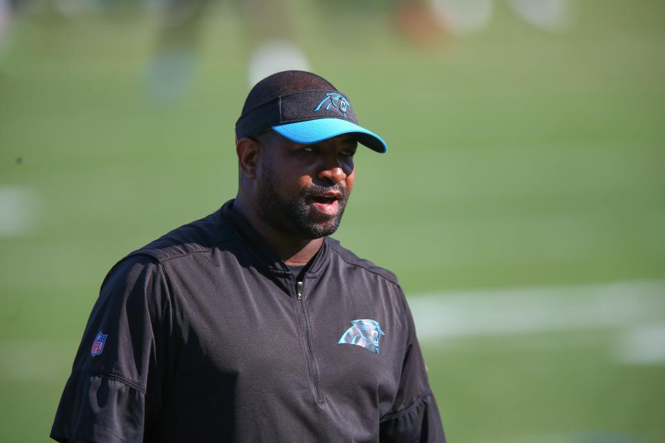 Carolina Panthers defensive line coach Sam Mills III runs a drill during a practice, June 11, 2019, in Charlotte, N.C.