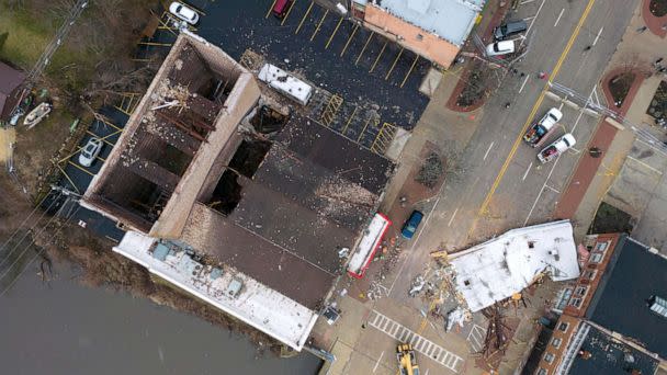 PHOTO: Crew members work to clean up debris at the scene where the roof of the Apollo Theatre collapsed during a tornado, on April 1, 2023, in Belvidere, Ill. (Erin Hooley/AP)