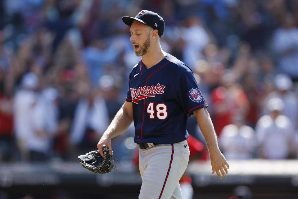 Minnesota Twins relief pitcher Tyler Thornburg walks off the field after giving up a game-winning, two-run home run to Cleveland Guardians' Andres Gimenez during the ninth inning of a baseball game Thursday, June 30, 2022, in Cleveland. (AP Photo/Ron Schwane)