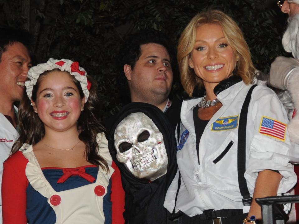 Kelly Ripa and her children Lola Grace Consuelos and Joaquin Antonio Consuelos participates in the New York City 40th Annual Village Halloween parade on October 31, 2013