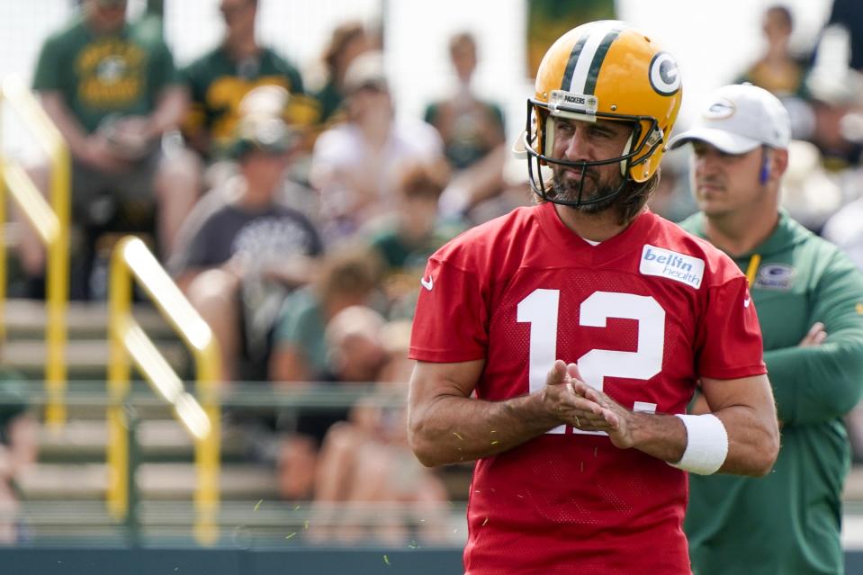 Green Bay Packers' Aaron Rodgers runs a drill at the NFL football team's practice field Wednesday, July 27, 2022, in Green Bay, Wis. (AP Photo/Morry Gash)