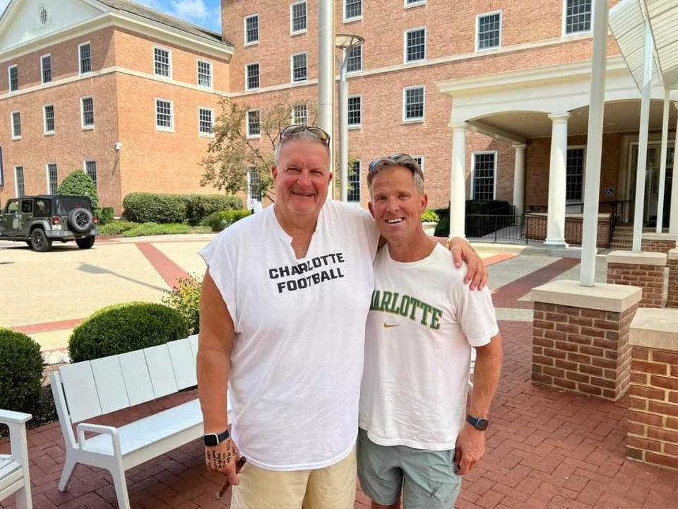 Charlotte coach Biff Poggi, left, and John McCurdy in College Park, Maryland, before Charlotte’s road game at the University of Maryland.